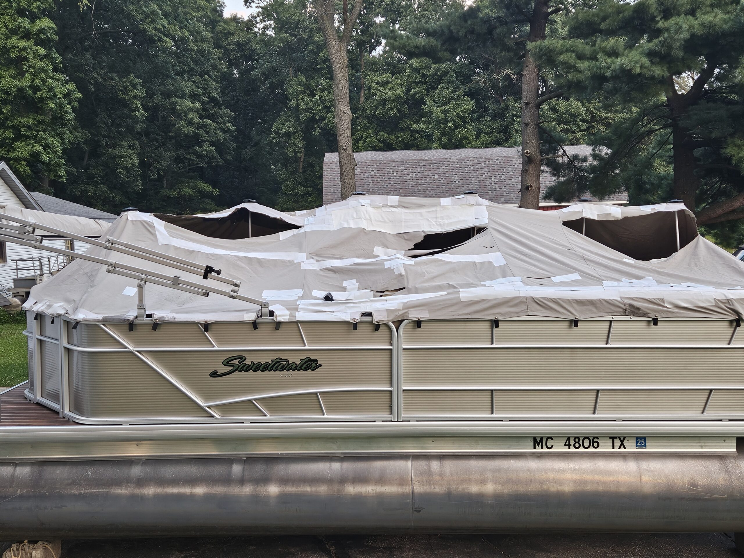 brown covered speed boat